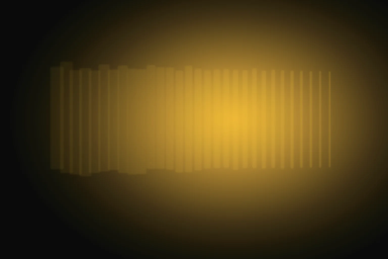 A soft amber haze on the left of a dark frame condensing into a clean, sharply defined form on the right